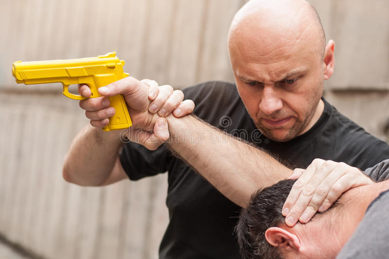 gun-disarm-self-defense-techniques-against-gun-point-kapap-instructor-demonstrates-75410773.jpg